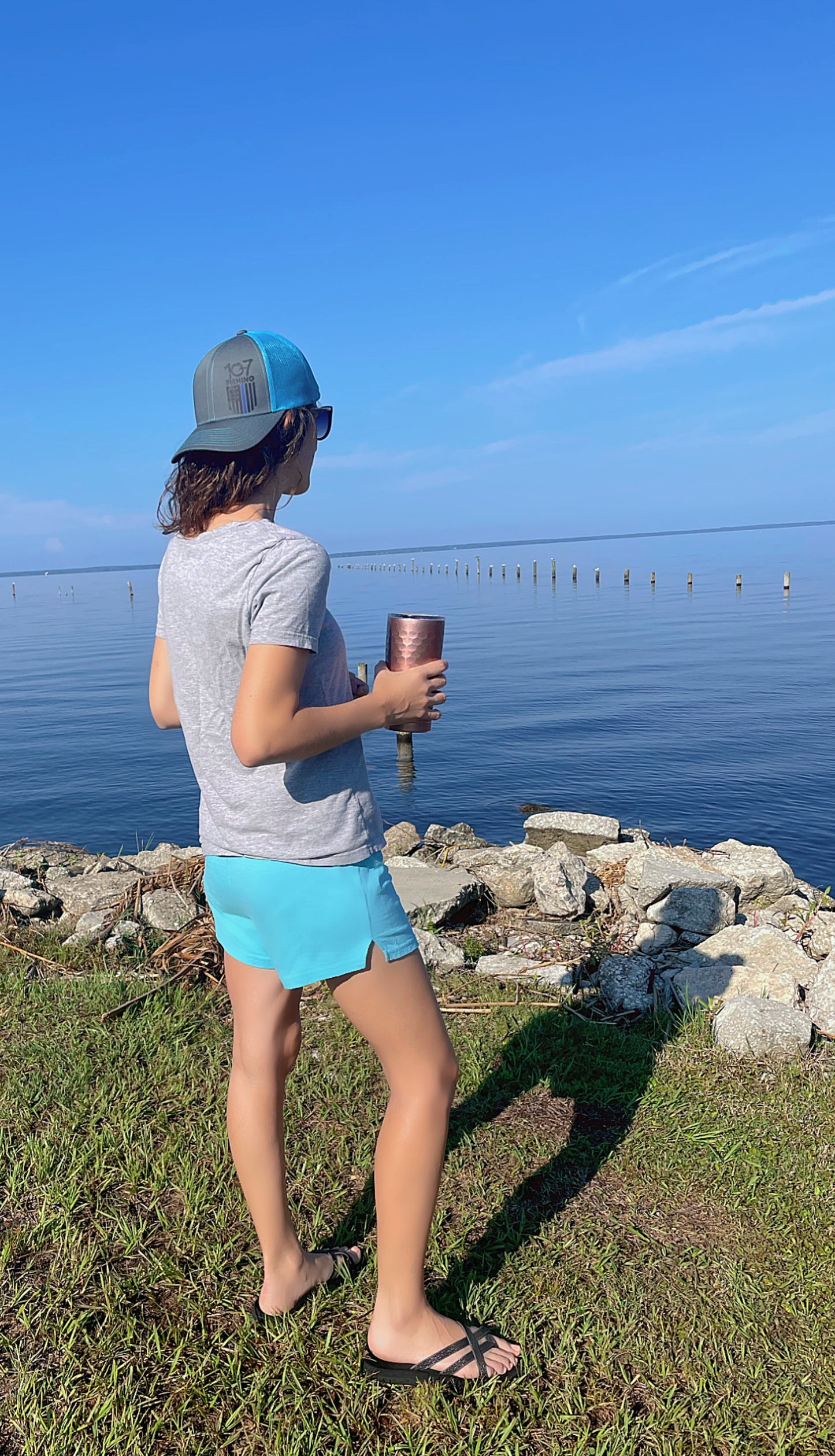 Neon blue flag logo trucker hat