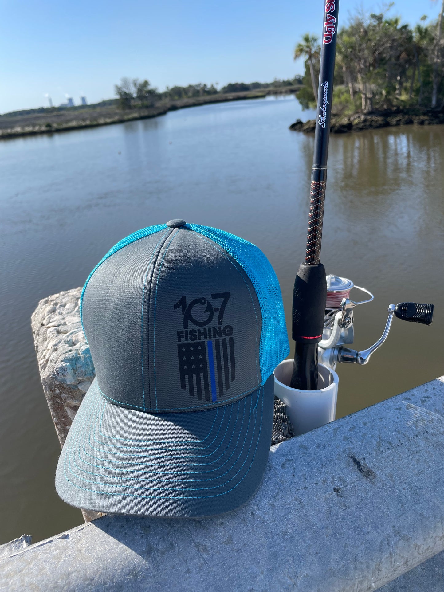 Neon blue flag logo trucker hat